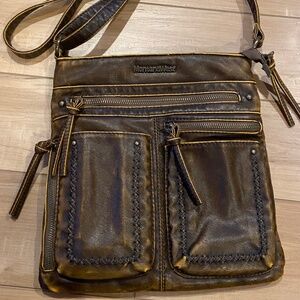 Montana West Vegan Leather Handbag . Color is brown . Medium size 12 x 9 .